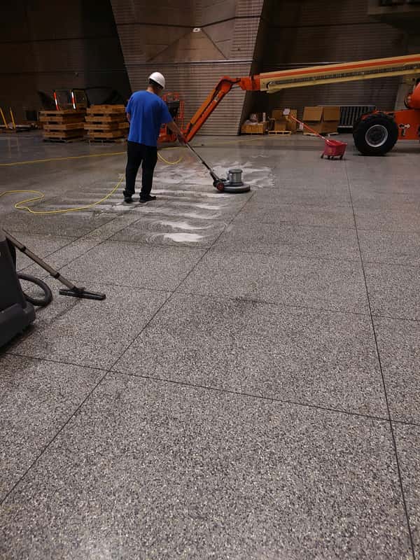 JSD technician machine scrubbing a facility floor