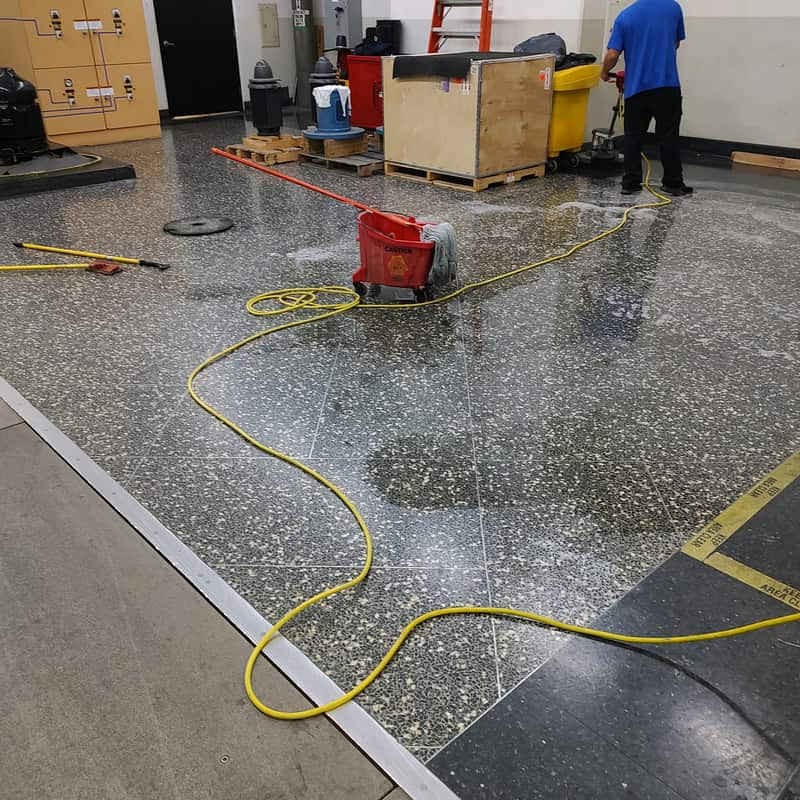 JSD technician cleaning a facility floor